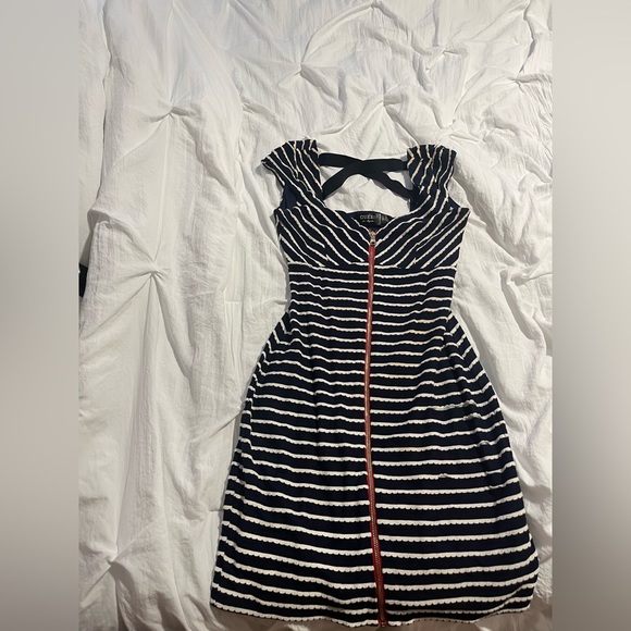 Guess mini dress with cross back detail and zipper in the front. Fair condition. - Picture 2 of 4